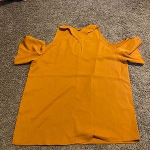 dressy top, shoulders are cut out